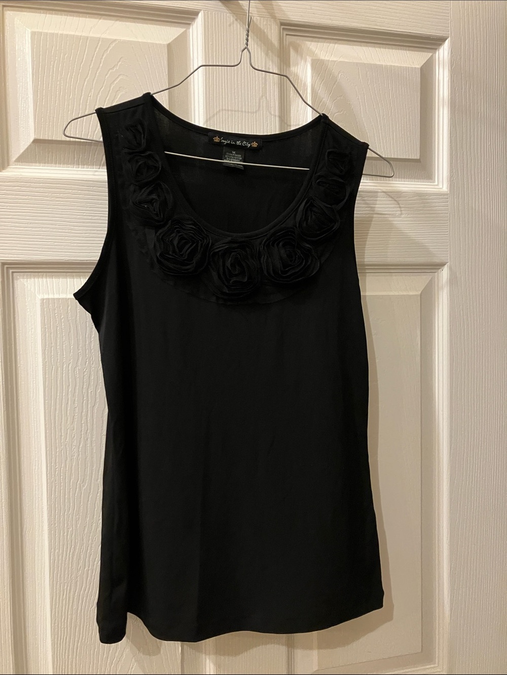 Suzie In The City Black Sleeveless Tank with Rosette Neckline